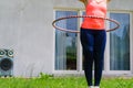 Young woman with hoola hoop outdoors Royalty Free Stock Photo