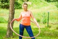 Young woman with hoola hoop outdoors Royalty Free Stock Photo
