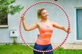 Young woman with hoola hoop outdoors Royalty Free Stock Photo