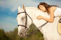 Young woman on a horse. Horseback rider, woman riding horse on b Royalty Free Stock Photo