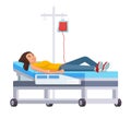 Young woman on the hospital bed is donating blood, blood transfusion