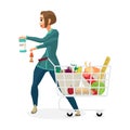 Young woman housewife in a supermarket with a full shopping cart Royalty Free Stock Photo