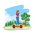 Young woman in hoverboard electric in the field