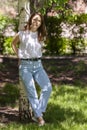 Young woman hugging Birch trees. Spring. Sunny worm day, enjoying outdoor Royalty Free Stock Photo