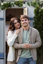 Young woman hugging boyfriend in cardigan Royalty Free Stock Photo