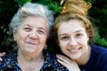 Young woman hugging her grandmother Royalty Free Stock Photo