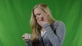 Young woman with hypersensitive teeth drinking a cup of hot drink, sensitive teeth