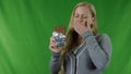 Young woman with hypersensitive teeth eating chocolate, sensitive teeth