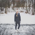 Young woman ice skating outdoors on a pond Royalty Free Stock Photo