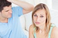 Young woman ignoring her angry boyfriend e Royalty Free Stock Photo