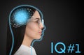 Young woman and illustrated head with brain on black background. IQ test