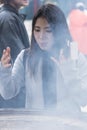 Young woman in Incense smoke Tokyo Royalty Free Stock Photo