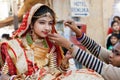 Young woman in indian dress sari wears jewelry