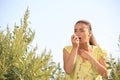 Young woman with inhaler suffering from ragweed allergy Royalty Free Stock Photo