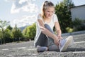 A young woman injured her ankle while doing sports Royalty Free Stock Photo