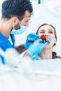 Young woman during innovative oral treatment Royalty Free Stock Photo