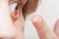 Young woman inserting contact lens Royalty Free Stock Photo