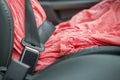 Young woman inside car buckled up with protective seat belt. Safety and precaution concept