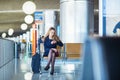 Young woman in international airport Royalty Free Stock Photo