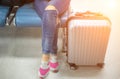 Young woman at international airport, waiting for her flight Royalty Free Stock Photo