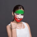 Young woman with Iran flag painted on her face Royalty Free Stock Photo
