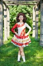 Young woman in irish dance dress posing outdoor