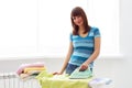 Young woman ironing