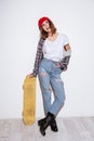 Young woman isolated over white background holding skateboard Royalty Free Stock Photo