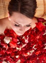 Young woman in jacuzzi with rose petal. Royalty Free Stock Photo