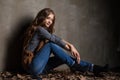 Young woman in jeans with autumn leaves Royalty Free Stock Photo