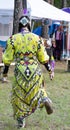 Young Native American Jingle Dancer Dancing with Her Back to the Camera at a Pow Wow