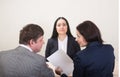 Young woman during job interview and members of managemen. Royalty Free Stock Photo