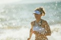 Young woman jogger on seashore in evening running Royalty Free Stock Photo