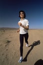 Young woman jogging in desert Royalty Free Stock Photo