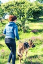 Young woman jogging with dog Royalty Free Stock Photo