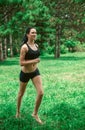 Young woman jogging outside in the park. Runners training outdoors