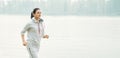 Young woman jogging outside in the park. Runners training outdoors