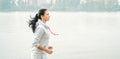 Young woman jogging outside in the park. Runners training outdoors