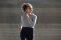 Young woman jogging outside in urban environment Royalty Free Stock Photo