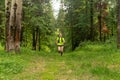 young woman jogging on a trail in a natural forest park Royalty Free Stock Photo