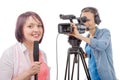 Young woman journalist with a microphone and camerawoman Royalty Free Stock Photo