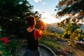 young woman juggling with bolls on the lake