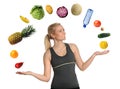 Young Woman Juggling Fruits and Vegetables Royalty Free Stock Photo