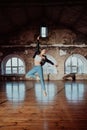 Woman jumping in casual style doing ballet in old studio. Attractive ballerina Royalty Free Stock Photo
