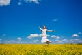 Young woman jumping on field Royalty Free Stock Photo