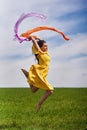 Young woman jumping for joy on a wheat field Royalty Free Stock Photo