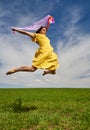 Young woman jumping for joy on a wheat field Royalty Free Stock Photo