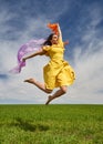 Young woman jumping for joy on a wheat field Royalty Free Stock Photo