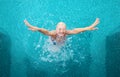 Young woman jumping out of the pool Royalty Free Stock Photo