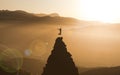 Young Woman jumping On top Of Mountain Peak Celebrating Success. Businesswoman Climber success and goal achievement Concept. Cliff Royalty Free Stock Photo